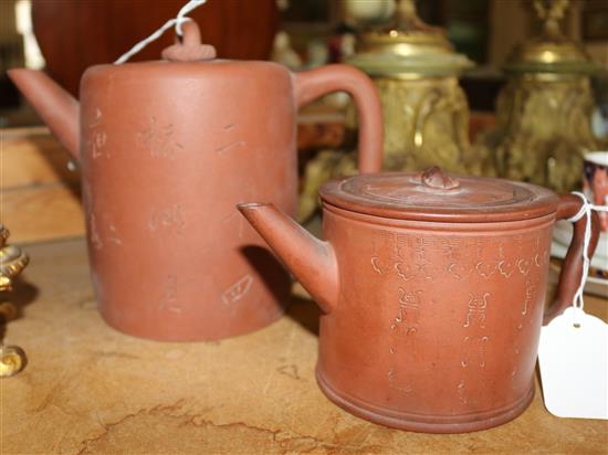 Two Chinese Yixing pottery cylindrical teapots and covers, late 19th century(-)